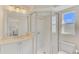 Bright bathroom with a shower and vanity at 531 N Spoonbill Dr, Sarasota, FL 34236