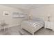 Cozy bedroom featuring a striped bedding, and a white wooden bed frame at 531 N Spoonbill Dr, Sarasota, FL 34236