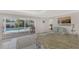 Kitchen with granite counter, view of pool, and access to outside at 531 N Spoonbill Dr, Sarasota, FL 34236