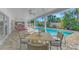 Relaxing patio with pool views and outdoor dining area at 531 N Spoonbill Dr, Sarasota, FL 34236