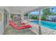 Relaxing pool area with lounge chairs and patio at 531 N Spoonbill Dr, Sarasota, FL 34236