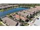 Aerial view of houses near a pond in a residential neighborhood at 5337 Popoli Way, Sarasota, FL 34238