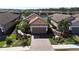 Aerial view of single-Gathering home with driveway and landscaping at 5337 Popoli Way, Sarasota, FL 34238