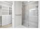 Spa-like bathroom with walk-in shower and built-in shelving at 5337 Popoli Way, Sarasota, FL 34238