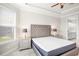 Main bedroom with tufted headboard and ensuite access at 5337 Popoli Way, Sarasota, FL 34238