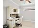 Bright home office features built-in desk and neutral color palette at 5337 Popoli Way, Sarasota, FL 34238