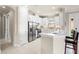 Modern kitchen featuring stainless steel appliances and white cabinetry at 5337 Popoli Way, Sarasota, FL 34238