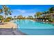 Expansive community swimming pool with lounge chairs at 5337 Popoli Way, Sarasota, FL 34238