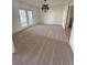 Dining room with carpeting and chandelier at 5345 Pamela Wood Way, Sarasota, FL 34233