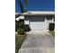 Single car garage with driveway at 5345 Pamela Wood Way, Sarasota, FL 34233