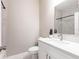 Clean bathroom, white vanity, and marble shower at 5534 Fairlane Dr, North Port, FL 34288