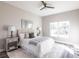 Bright bedroom with a queen-sized bed and a ceiling fan at 5534 Fairlane Dr, North Port, FL 34288