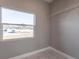 Bright closet with window and hanging rods at 5534 Fairlane Dr, North Port, FL 34288