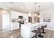 Modern kitchen with white cabinets, quartz countertops, and stainless steel appliances at 5534 Fairlane Dr, North Port, FL 34288