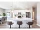 Open concept kitchen island with white cabinets and quartz countertops at 5534 Fairlane Dr, North Port, FL 34288