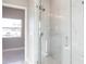 Large walk-in shower with marble tile and glass enclosure at 5534 Fairlane Dr, North Port, FL 34288