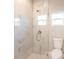 Shower with marble tile and glass enclosure at 5534 Fairlane Dr, North Port, FL 34288