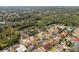 Aerial view of a neighborhood with houses and lush greenery at 5574 Sweetwater Oak, Sarasota, FL 34232