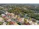 Aerial view of houses with pools in a community by a canal at 5574 Sweetwater Oak, Sarasota, FL 34232