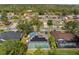 Wide aerial view of neighborhood, highlighting community features at 5574 Sweetwater Oak, Sarasota, FL 34232