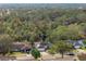 Aerial view of a house with a pool, located in a quiet residential neighborhood at 5574 Sweetwater Oak, Sarasota, FL 34232