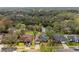 Aerial view of a house with a pool near a waterway at 5574 Sweetwater Oak, Sarasota, FL 34232