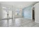 Dining room with tile floor, window, and accent wall at 5574 Sweetwater Oak, Sarasota, FL 34232