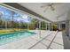 Screened pool and patio area at 5574 Sweetwater Oak, Sarasota, FL 34232