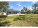 Relaxing pool area with a large screened enclosure and patio at 5574 Sweetwater Oak, Sarasota, FL 34232