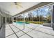 Screened pool area with spacious patio at 5574 Sweetwater Oak, Sarasota, FL 34232