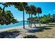 Scenic waterfront lot with palm trees and sandy beach at 5612 Ashton Lake Dr # 5612, Sarasota, FL 34231