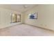 Bright bedroom with vaulted ceiling, carpet, and window at 5612 Ashton Lake Dr # 5612, Sarasota, FL 34231