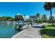 Several small boats and yachts are moored at the slips along the waterfront at 5612 Ashton Lake Dr # 5612, Sarasota, FL 34231