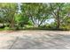 Landscaped entrance to community with a welcoming sign at 5612 Ashton Lake Dr # 5612, Sarasota, FL 34231