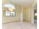 Bright dining room with large window and chandelier at 5612 Ashton Lake Dr # 5612, Sarasota, FL 34231