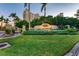 Sarasota Bay Club entrance with lush landscaping and building view at 5612 Ashton Lake Dr # 5612, Sarasota, FL 34231