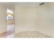 Clean and bright hallway with tiled floors and neutral walls at 5612 Ashton Lake Dr # 5612, Sarasota, FL 34231