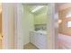 Convenient laundry room with washer, dryer, and storage cabinets at 5612 Ashton Lake Dr # 5612, Sarasota, FL 34231