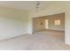 Open living area with neutral color palette and carpet at 5612 Ashton Lake Dr # 5612, Sarasota, FL 34231