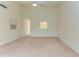 Bright living room with vaulted ceiling,carpet, and view to kitchen at 5612 Ashton Lake Dr # 5612, Sarasota, FL 34231