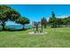 Landscaped park with a unique metal sculpture and waterfront views at 5612 Ashton Lake Dr # 5612, Sarasota, FL 34231