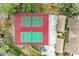 Two tennis courts with red surface and green lines at 5612 Ashton Lake Dr # 5612, Sarasota, FL 34231