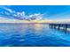 Tranquil waterfront view with a pier at sunset at 5612 Ashton Lake Dr # 5612, Sarasota, FL 34231