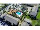 Community pool and surrounding buildings from above at 5640 Westwind Ln, Sarasota, FL 34231