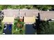 Aerial view showing two-unit building with garages and landscaping at 5640 Westwind Ln, Sarasota, FL 34231