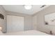 Bedroom with double closet and view of a picture at 5640 Westwind Ln, Sarasota, FL 34231