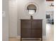 Entryway with a dark brown shoe cabinet and a circular mirror at 5640 Westwind Ln, Sarasota, FL 34231