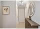 Bright hallway with light walls and a dark brown cabinet at 5640 Westwind Ln, Sarasota, FL 34231