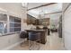 Modern kitchen with breakfast bar and dark brown cabinets at 5640 Westwind Ln, Sarasota, FL 34231