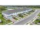 Aerial view of townhouses with attached garages and landscaped yards at 5703 Tripoli Dr, Palmetto, FL 34221